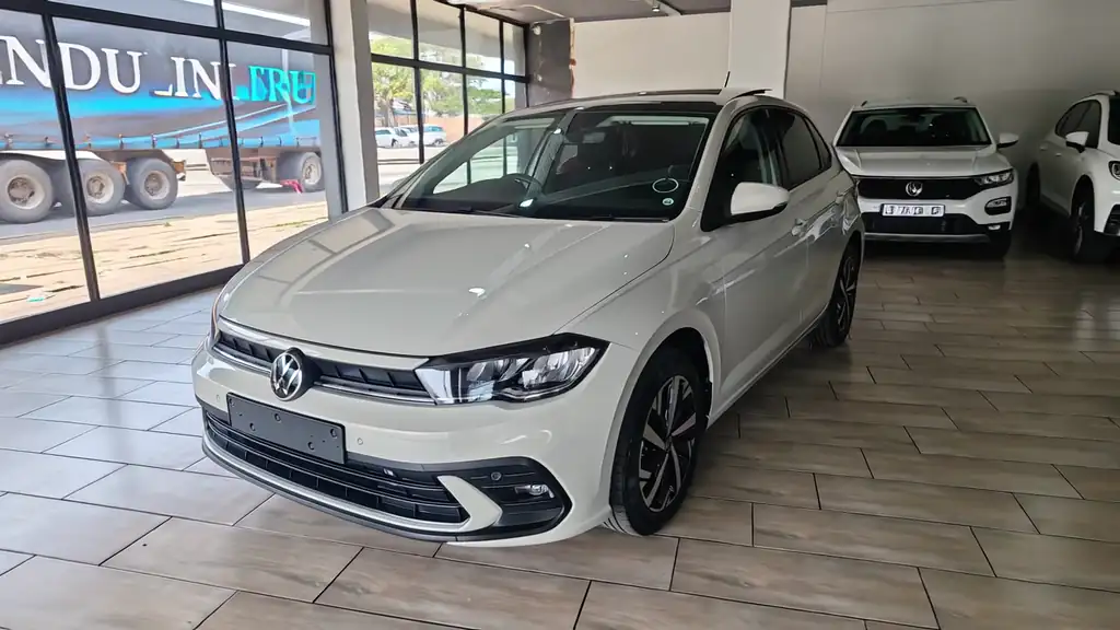 White Volkswagen Polo in a dealer showroom, 360 spin